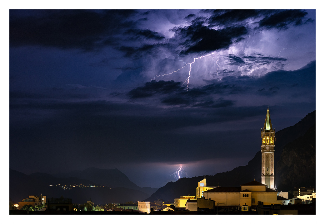 spectacular lightning in mountains over italian rooftops art print